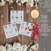 Load image into Gallery viewer, A collection of cards with illustrations of different herbs and crystals that have various meanings and properties. The cards are white with black text and colorful illustrations. The cards are placed on a wooden background with white flowers and a lit candle. The image also has text that says the product is from Polka Dot Designs Teapot Charms &amp; Tools and is for personal use only.
