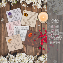 Load image into Gallery viewer, A collection of cards with illustrations of different herbs and crystals that have various meanings and properties. The cards are white with black text and colorful illustrations. The cards are placed on a wooden background with white flowers and a lit candle. The image also has text that says the product is from Polka Dot Designs Teapot Charms &amp; Tools and is for personal use only.
