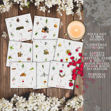 Load image into Gallery viewer, A collection of cards with illustrations of different herbs and crystals that have various meanings and properties. The cards are white with black text and colorful illustrations. The cards are placed on a wooden background with white flowers and a lit candle. The image also has text that says the product is from Polka Dot Designs Teapot Charms &amp; Tools and is for personal use only.
