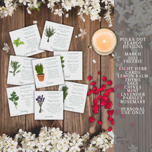 Load image into Gallery viewer, A collection of cards with illustrations of different herbs and crystals that have various meanings and properties. The cards are white with black text and colorful illustrations. The cards are placed on a wooden background with white flowers and a lit candle. The image also has text that says the product is from Polka Dot Designs Teapot Charms &amp; Tools and is for personal use only.
